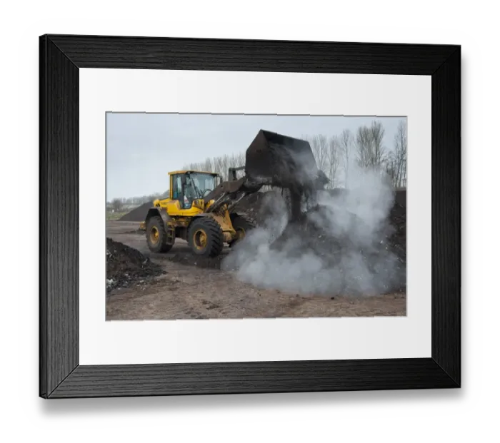 Framed Print : Volvo loader turning green compost waste for aeration at municipal waste site, near Chester, Cheshire, England, march Framed Print : Volvo loader turning green compost waste for aeration at municipal waste site, near Chester, Cheshire, England, march