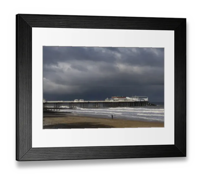 Framed Print : View of beach and pier of seaside town, with stormclouds overhead, Cromer Pier, Cromer, Norfolk, England, november