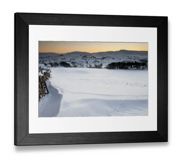 Framed Print : View of snow covered farmland in evening, overlooking Ravenstonedale area on northern fringe of Howgill Fells, Cumbria