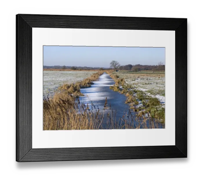 Framed Print : View of frozen dyke across snow covered wetland habitat, Buckenham Marshes RSPB Reserve, River Yare, Yare Valley Framed Print : View of frozen dyke across snow covered wetland habitat, Buckenham Marshes RSPB Reserve, River Yare, Yare Valley