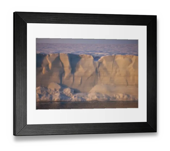 Framed Print : Coastal glacier terminus with waterfall from melting ice at sunset, Brasvellbreen Glacier, Nordaustlandet, Svalbard Framed Print : Coastal glacier terminus with waterfall from melting ice at sunset, Brasvellbreen Glacier, Nordaustlandet, Svalbard