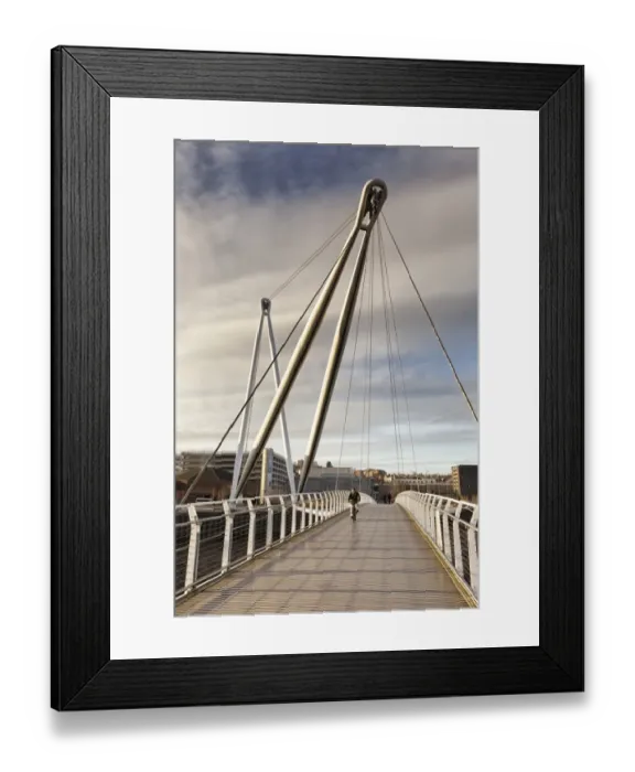 Framed Print : Man on bicycle crossing footbridge over river, Newport City Footbridge, River Usk, Newport, South Wales, Wales, january Framed Print : Man on bicycle crossing footbridge over river, Newport City Footbridge, River Usk, Newport, South Wales, Wales, january