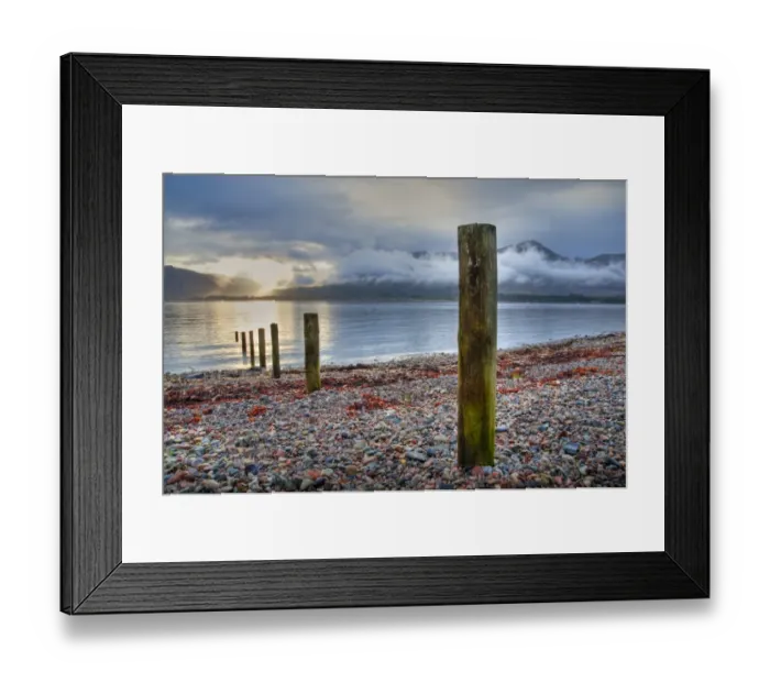 Framed Print : Wooden posts on shore of sea loch at sunset, Loch Linnhe, Onich, Highlands, Scotland, april