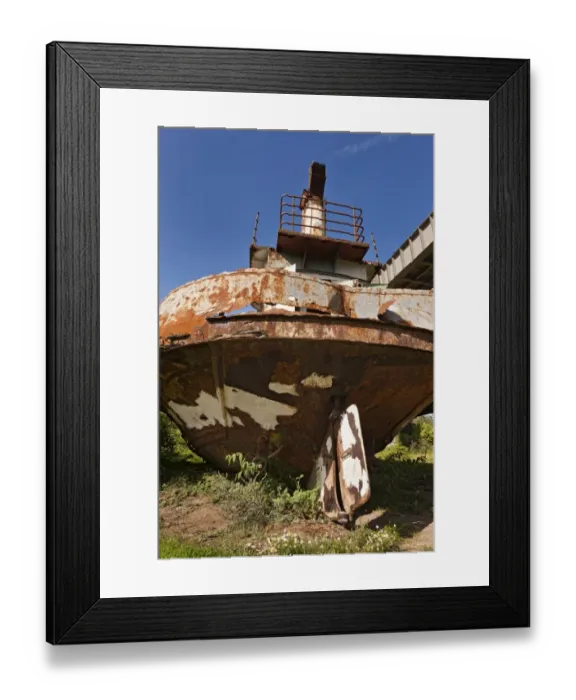 Framed Print : Rusting hulk of old ferry boat on bank of river, Chepstow, River Wye, Wye Valley, Monmouthshire, Wales, august