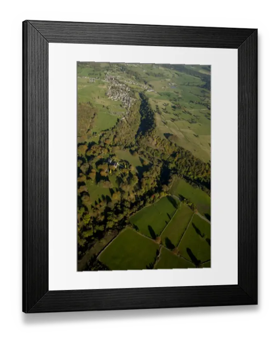 Framed Print : Aerial view of wooded valley, farmland and village, Bradford Dale, White Peak, Peak District, Derbyshire, England Framed Print : Aerial view of wooded valley, farmland and village, Bradford Dale, White Peak, Peak District, Derbyshire, England