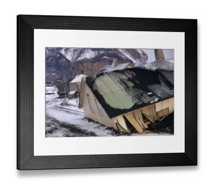 Framed Print : Destruction of town following eruption of volcano, houses moved into street by lava flow, Eldfell Volcano, Heimaey Framed Print : Destruction of town following eruption of volcano, houses moved into street by lava flow, Eldfell Volcano, Heimaey