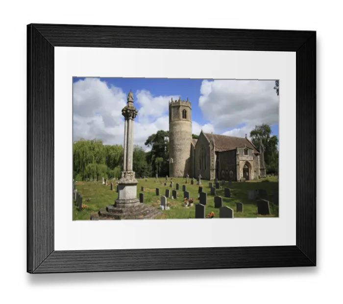 Framed Print : Memorial cross in graveyard, church with Norman round-tower, St. Marys Church, Rickinghall Inferior, Suffolk, England Framed Print : Memorial cross in graveyard, church with Norman round-tower, St. Marys Church, Rickinghall Inferior, Suffolk, England