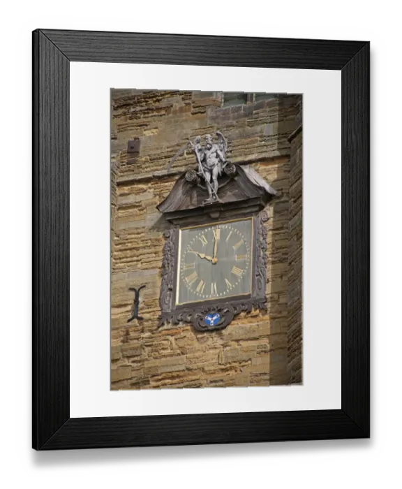 Framed Print : Decorative clock with Old Father Time on church tower, Cranbrook, Kent, England, august Framed Print : Decorative clock with Old Father Time on church tower, Cranbrook, Kent, England, august