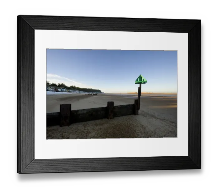 Framed Print : View of groyne on beach, with distant beach huts in snow, Wells-next-the-sea, Norfolk, England, december Framed Print : View of groyne on beach, with distant beach huts in snow, Wells-next-the-sea, Norfolk, England, december