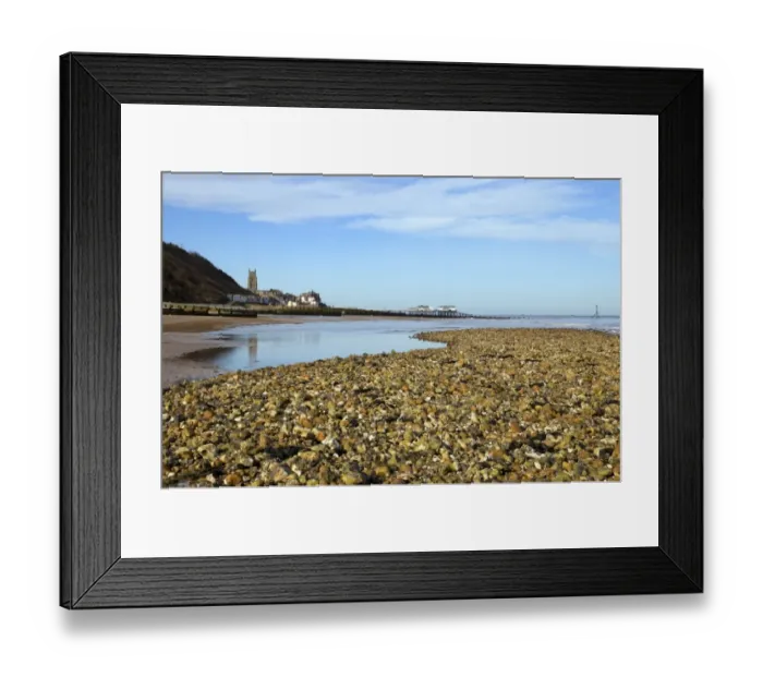Framed Print : View of beach with seaside town and pier in background, Cromer, Norfolk, England, february Framed Print : View of beach with seaside town and pier in background, Cromer, Norfolk, England, february