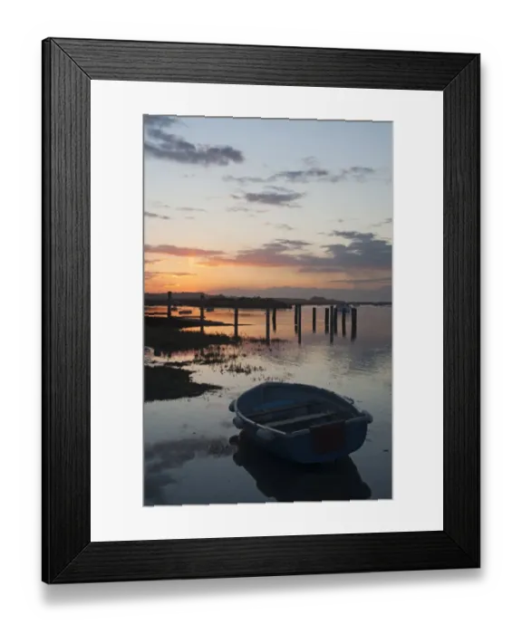 Framed Print : View of boats in coastal creek at high tide, silhouetted at sunset, Burnham Deepdale, Norfolk, England, march