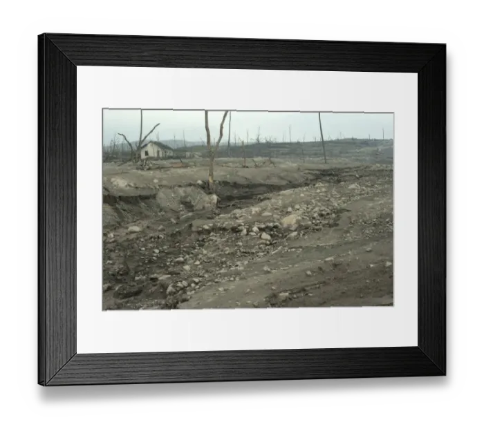 Framed Print : Riverbed and field covered in ash, damaged houses and dead trees, from recent volcanic eruption, Kepuharjo