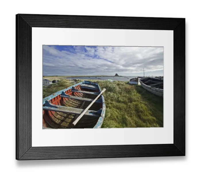 Framed Print : View of boats and coastline with castle in distance, Lindisfarne Castle, Lindisfarne, Northumberland, England Framed Print : View of boats and coastline with castle in distance, Lindisfarne Castle, Lindisfarne, Northumberland, England