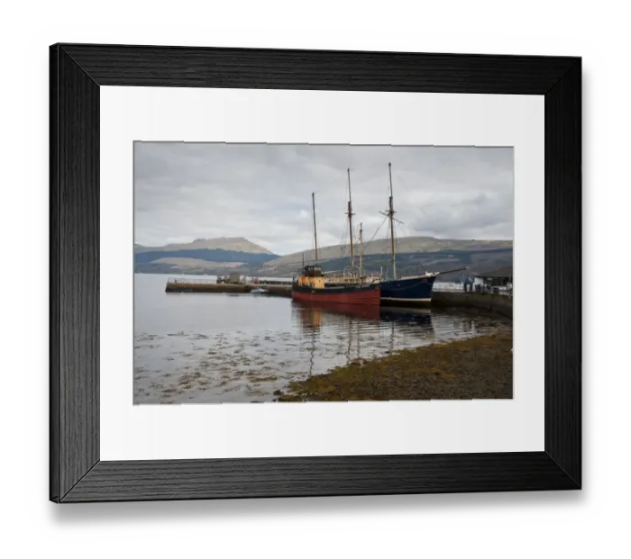 Framed Print : Boats moored at jetty on shore of sea loch, Inverary, Loch Fyne, Argyll and Bute, Scotland, april