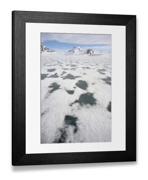 Framed Print : View of sea ice and snow covered coastal mountains, Spitsbergen, Svalbard, late spring Framed Print : View of sea ice and snow covered coastal mountains, Spitsbergen, Svalbard, late spring