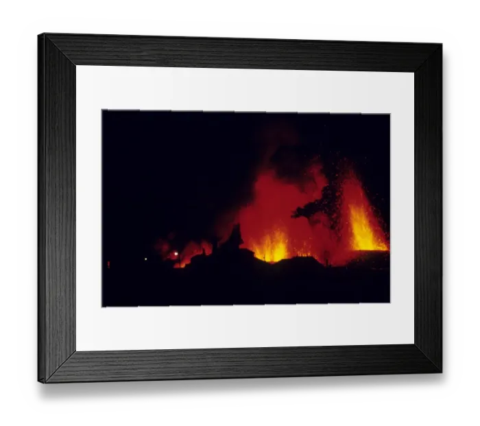 Framed Print : Volcanic eruption, with erupting lava and town buildings silhouetted, Eldfell Volcano, Heimaey, Westmann Isles Framed Print : Volcanic eruption, with erupting lava and town buildings silhouetted, Eldfell Volcano, Heimaey, Westmann Isles