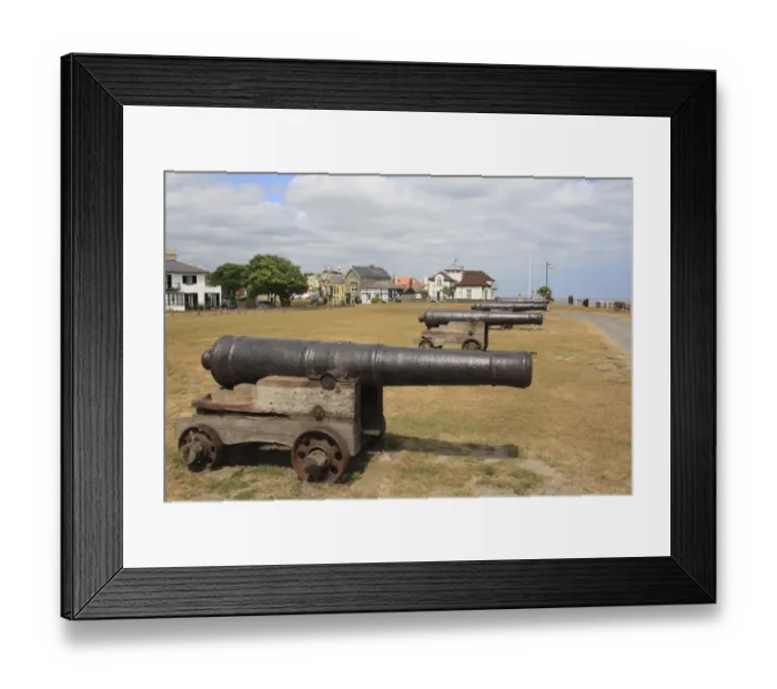 Framed Print : 18th Century 18-pounder guns on seafront of seaside town, Gun Hill, Southwold, Suffolk, England, may