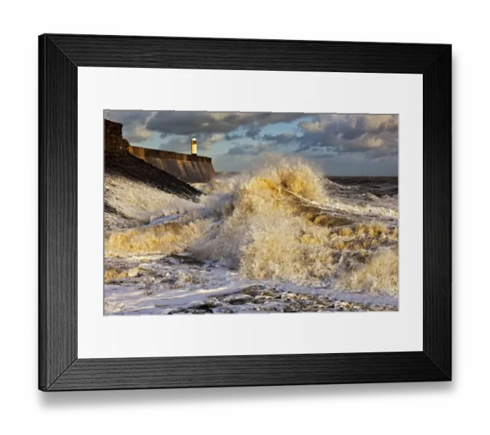 Framed Print : Coastal resort town seafront and lighthouse bombarded by waves, Porthcawl Pier, Porthcawl, Bristol Channel