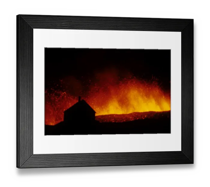 Framed Print : Volcanic eruption, erupting lava with town house silhouetted, Eldfell Volcano, Heimaey, Westmann Isles, Iceland, 1973 Framed Print : Volcanic eruption, erupting lava with town house silhouetted, Eldfell Volcano, Heimaey, Westmann Isles, Iceland, 1973