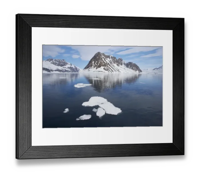Framed Print : View of melting sea ice and snow covered coastal mountains, Spitsbergen, Svalbard, late spring Framed Print : View of melting sea ice and snow covered coastal mountains, Spitsbergen, Svalbard, late spring