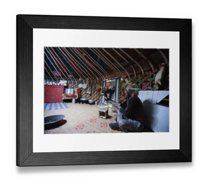 Framed Print : Kazakh hunter with hooded Golden Eagle (Aquila chrysaetos), sitting inside ger tent, Altai Mountains, Bayan-Ulgii Framed Print : Kazakh hunter with hooded Golden Eagle (Aquila chrysaetos), sitting inside ger tent, Altai Mountains, Bayan-Ulgii