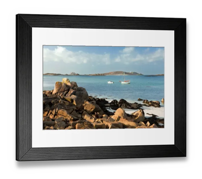 Framed Print : View of coast with two small boats moored, looking across to St. Helens and Round Island, Cradle Porth