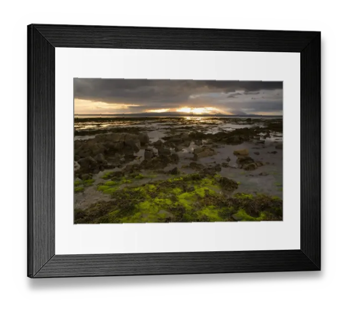 Framed Print : Sunset over rocky shore at low tide, with Isle of Arran and Holy Island in distance, Culzean Bay, South Ayrshire