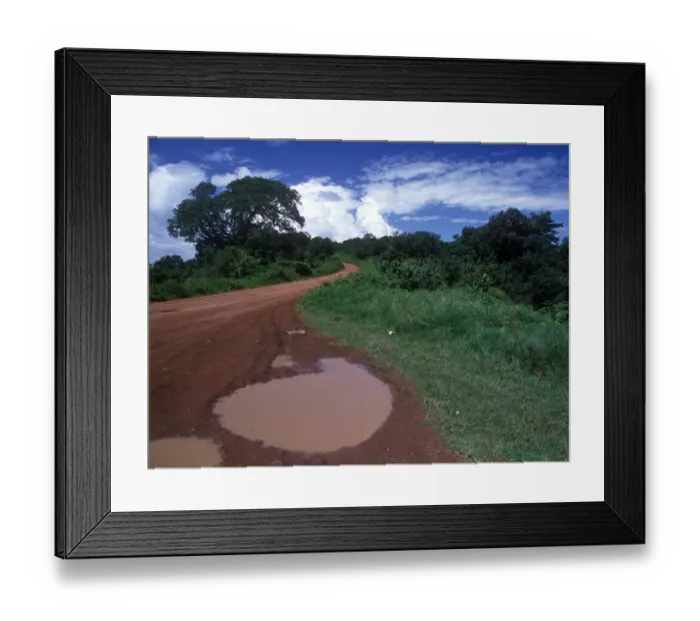 Framed Print : Rain Puddle on African road Framed Print : Rain Puddle on African road