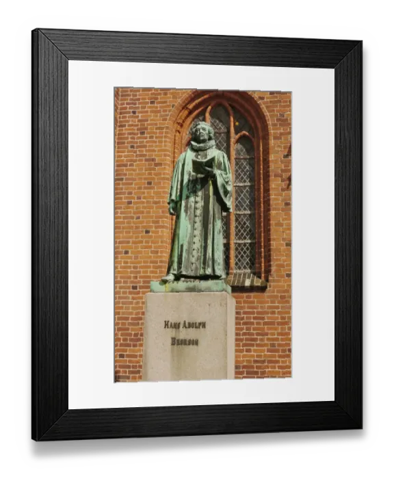 Framed Print : Statue of Hans Adolph Brorson (1694 - 1764), standing beside cathedral in historic town