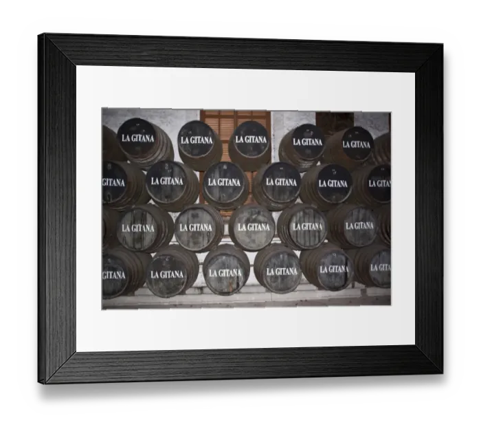 Framed Print : La Gitana sherry at Sanlucar de la Barrameda. Sherry is matured slowing in these barrels before bottling Framed Print : La Gitana sherry at Sanlucar de la Barrameda. Sherry is matured slowing in these barrels before bottling