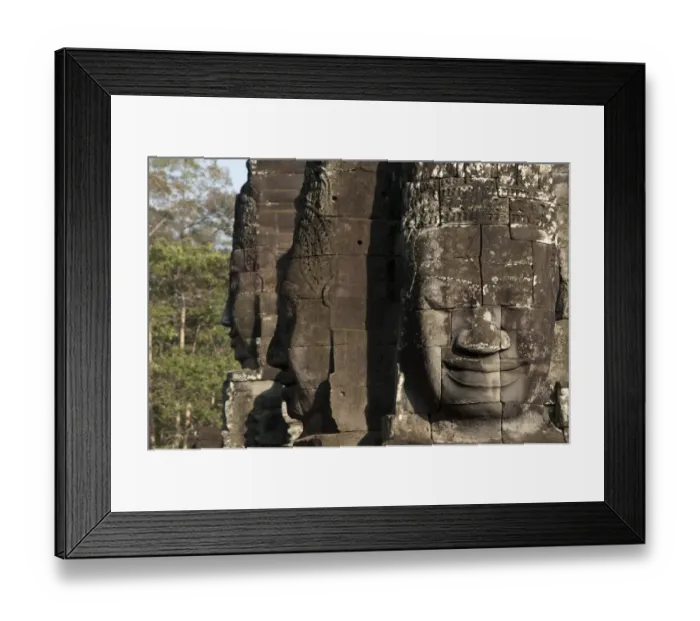 Framed Print : Large sculptures of heads on tower of Khmer temple, Bayon, Angkor Thom, Siem Riep, Cambodia Framed Print : Large sculptures of heads on tower of Khmer temple, Bayon, Angkor Thom, Siem Riep, Cambodia