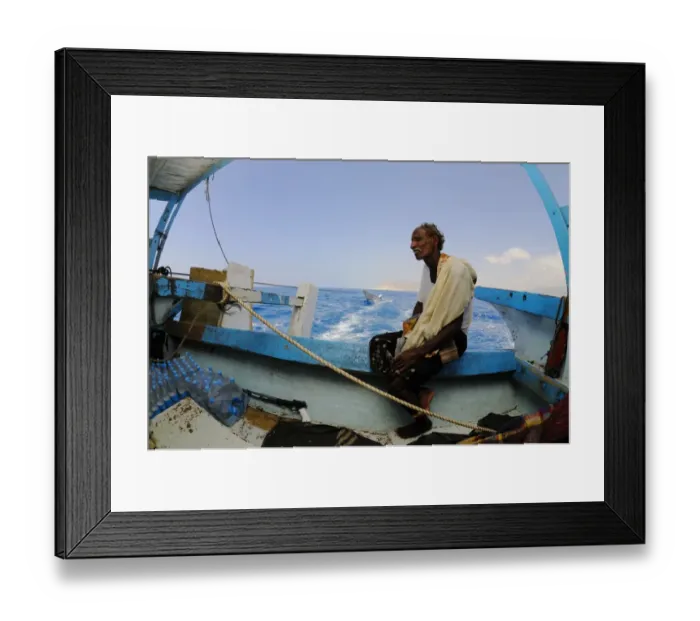Framed Print : Local fisherman sitting on boat at sea, Socotra, Yemen, march Framed Print : Local fisherman sitting on boat at sea, Socotra, Yemen, march