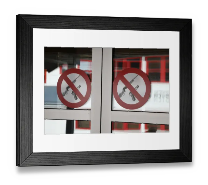 Framed Print : No firearms prohibitive sign for weapons at entrance to bank, worlds most northerly town, Longyearbyen, Spitsbergen