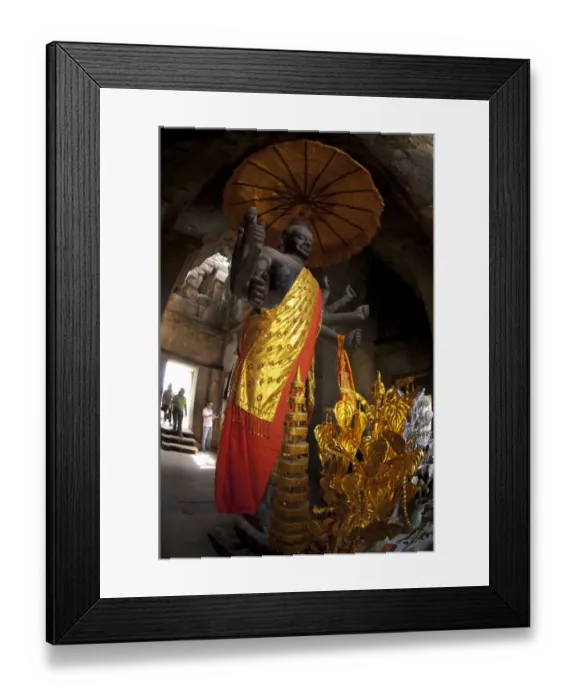 Framed Print : Standing deity with umbrella in Khmer temple, Angkor Wat, Siem Riep, Cambodia