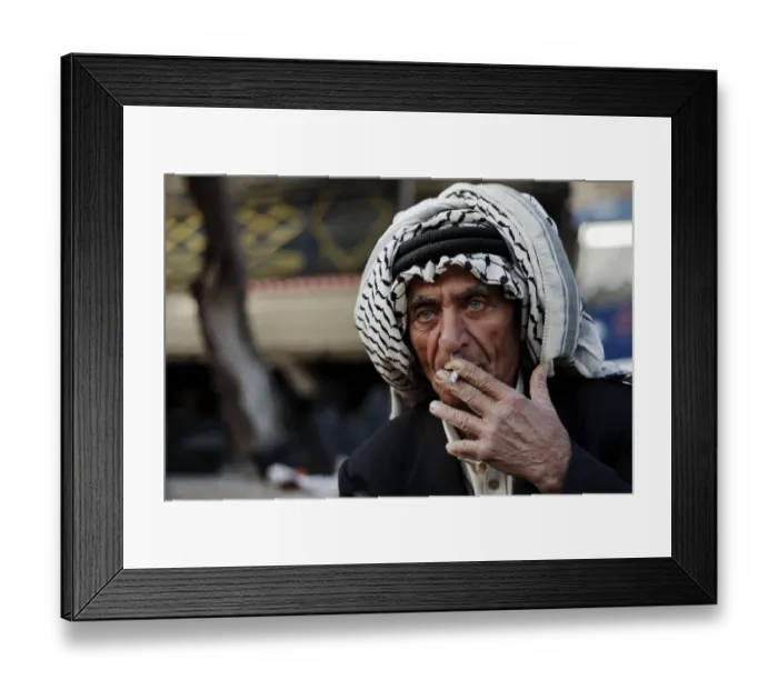 Framed Print : Market vendor, man smoking cigarette, close-up of head, Amman, Jordan, november Framed Print : Market vendor, man smoking cigarette, close-up of head, Amman, Jordan, november