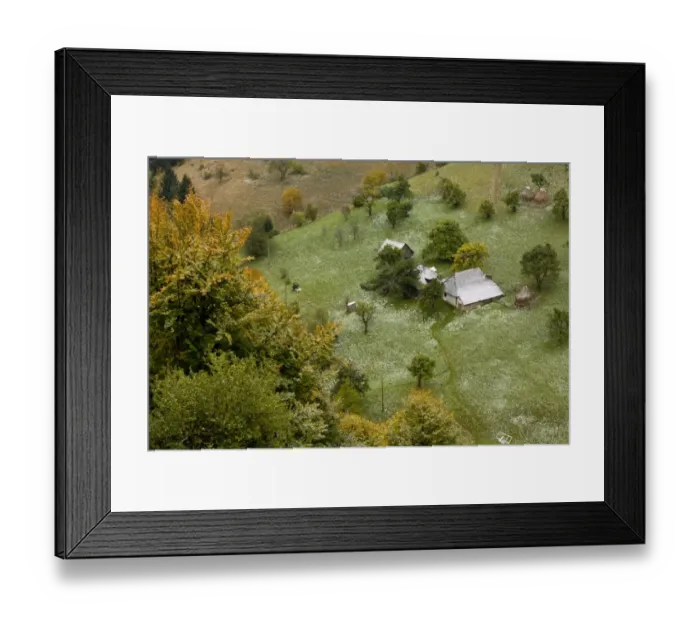 Framed Print : View of traditional farmland, with old houses, barns, fruit trees and pasture under light covering of snow in autumn Framed Print : View of traditional farmland, with old houses, barns, fruit trees and pasture under light covering of snow in autumn