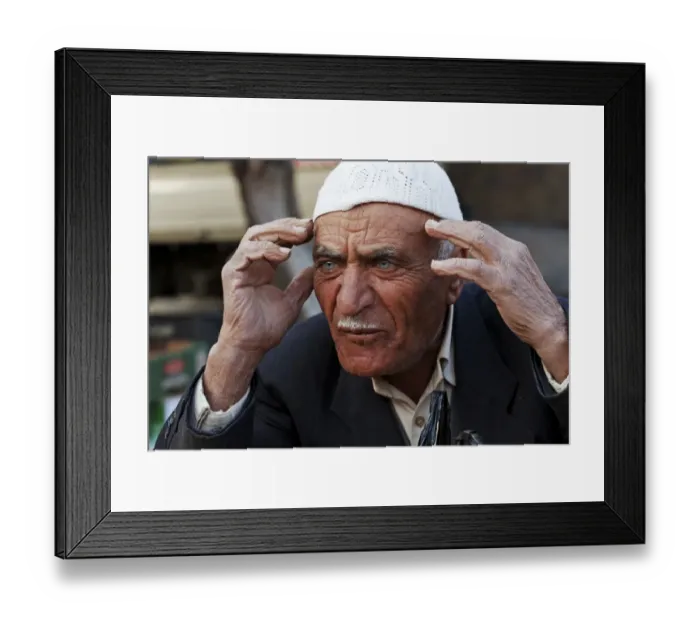 Framed Print : Market vendor, man holding hands to head, Amman, Jordan, november Framed Print : Market vendor, man holding hands to head, Amman, Jordan, november