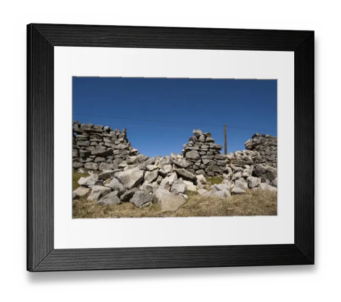 Framed Print : Drystone wall in poor state of repair, gaps filled with barbed wire, England, april Framed Print : Drystone wall in poor state of repair, gaps filled with barbed wire, England, april