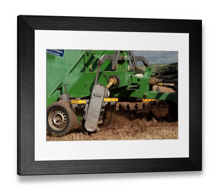 Framed Print : Close-up of stone picker going over newly ploughed field, England, september Framed Print : Close-up of stone picker going over newly ploughed field, England, september