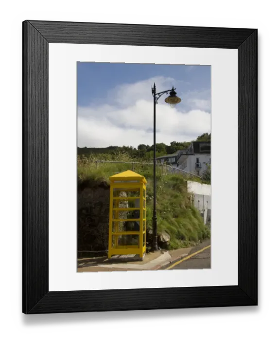 Framed Print : Yellow phone box on Jersey at Bouley Bay