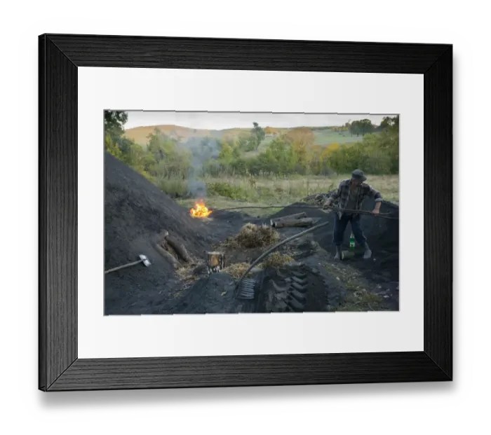Framed Print : Charcoal burning, charcoal burner lighting pile in traditional yard, Viscri Saxon village, Transylvania, Romania Framed Print : Charcoal burning, charcoal burner lighting pile in traditional yard, Viscri Saxon village, Transylvania, Romania