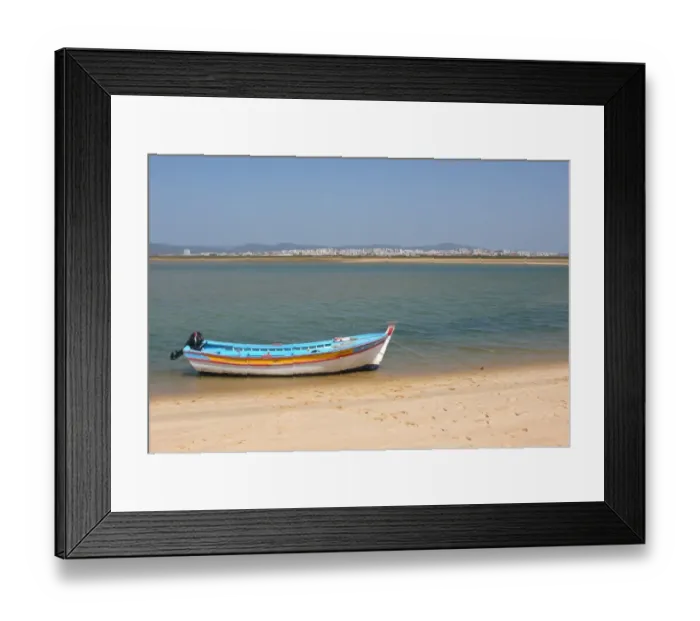Framed Print : View of city from coastal island with fishing boat, Figo, Algarve, Portugal, april Framed Print : View of city from coastal island with fishing boat, Figo, Algarve, Portugal, april