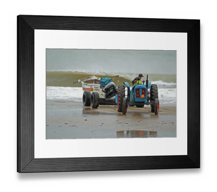 Framed Print : Tractor and trailer landing crab fishing boat on beach, Cromer, Norfolk, England, august Framed Print : Tractor and trailer landing crab fishing boat on beach, Cromer, Norfolk, England, august