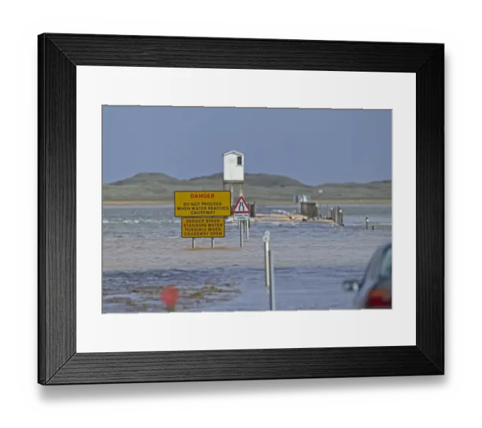 Framed Print : Danger, do not proceed when water reaches causeway sign on causeway underwater at high tide, Lindisfarne Framed Print : Danger, do not proceed when water reaches causeway sign on causeway underwater at high tide, Lindisfarne