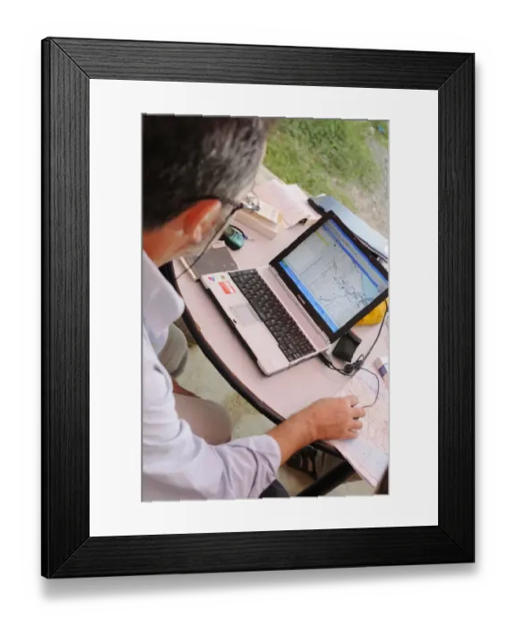 Framed Print : Researcher plotting survey data on GIS software, Socotra, Yemen, december