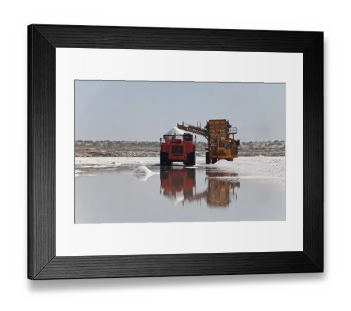 Framed Print : Commercial salt production, machinery collecting salt from saltpans, Exportadora de Sal (ESSA) saltworks