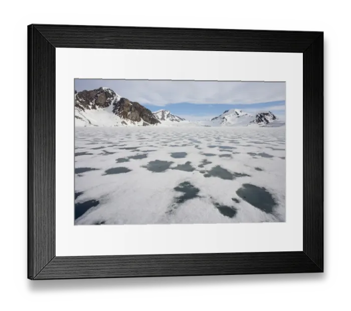 Framed Print : View of sea ice and snow covered coastal mountains, Spitsbergen, Svalbard, late spring
