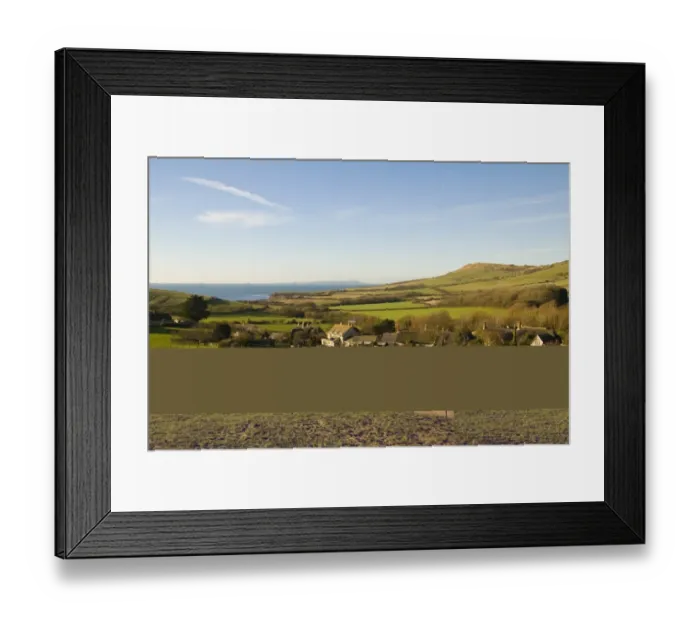 Framed Print : View over coastal farmland, with pasture, village houses and distant sea, Isle of Portland in distance, Kimmeridge Framed Print : View over coastal farmland, with pasture, village houses and distant sea, Isle of Portland in distance, Kimmeridge