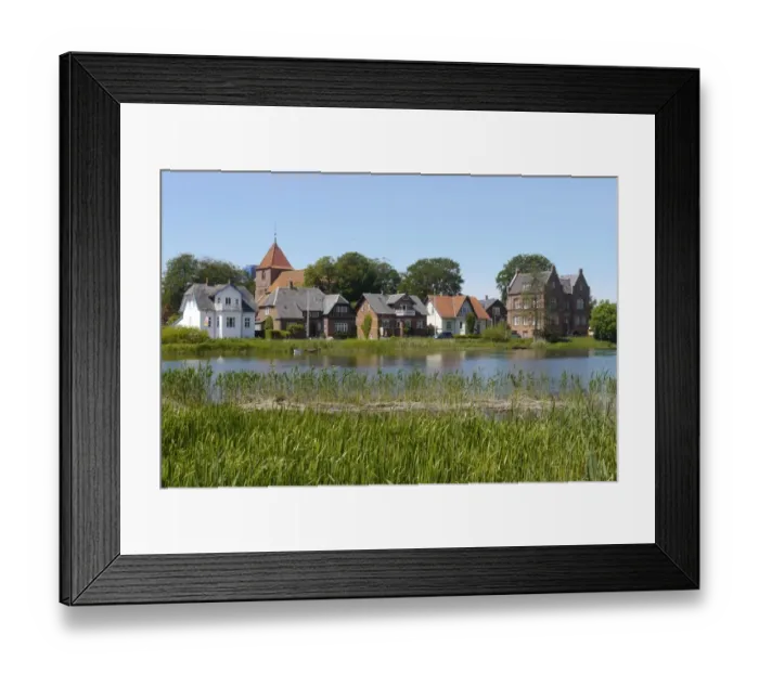 Framed Print : View across river towards historic town, Ribe, Jutland, Denmark, may Framed Print : View across river towards historic town, Ribe, Jutland, Denmark, may