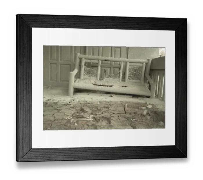 Framed Print : Ash covered seat outside house damaged from recent volcanic eruption, Kepuharjo, Mount Merapi, Central Java, Indonesia